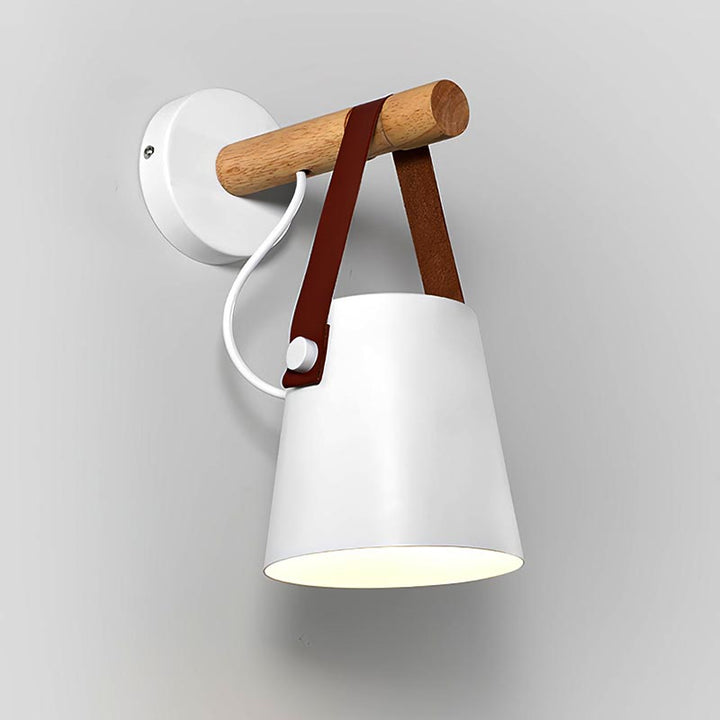 Wall-mounted lamp with wooden handle and white shade on a gray background