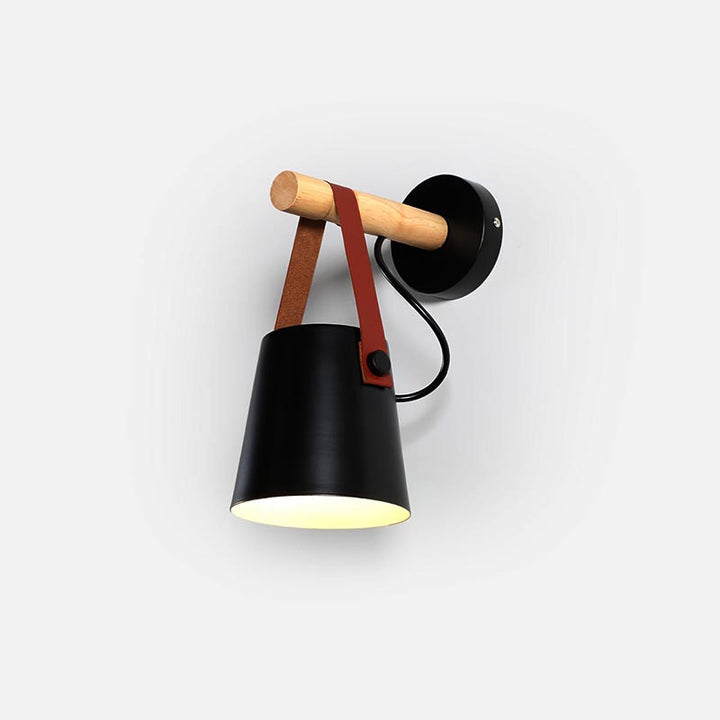 Wall-mounted lamp with black shade, wooden arm, and brown leather strap on a white background