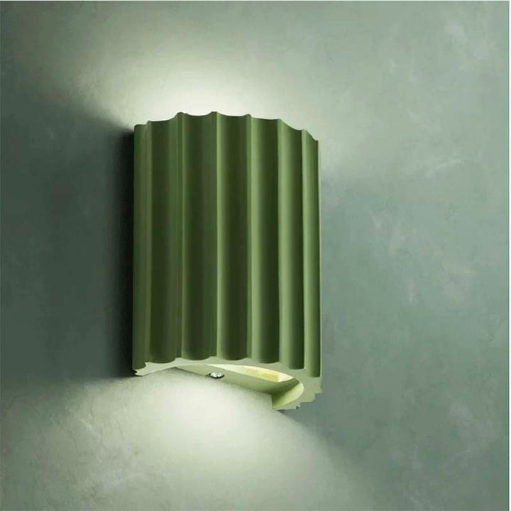 Modern Green wall-mounted light fixture on a grey wall
