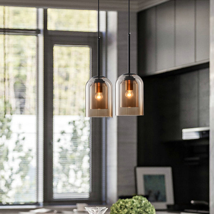 Pair of amber glass pendant lights above kitchen island