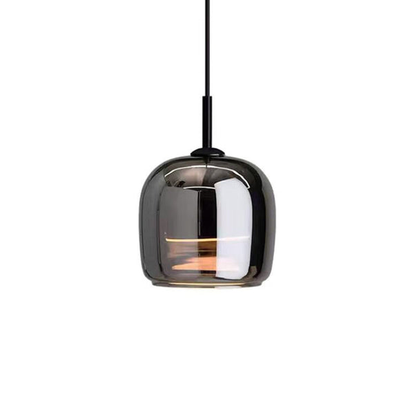 Modern pendant light with smoked glass shade on a white background