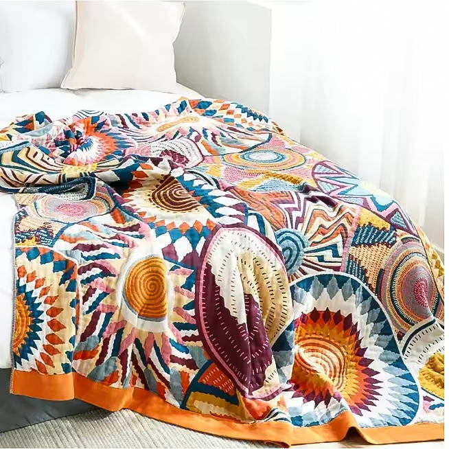 Large Nordic cotton throw blanket, soft woven comfort, colorful abstract pattern on bed