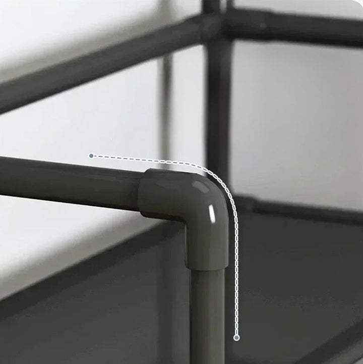 Close-up of black corner joint showing secure pipe fitting on plastic shoe and coat rack.