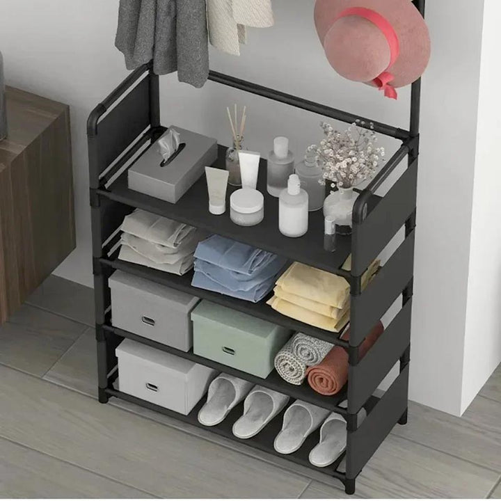 White 5-tier freestanding shoe and coat rack with hooks, shown in modern neutral bedroom setting with entryway use.