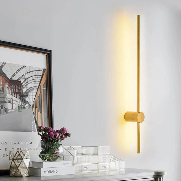 Gold LINJE Nordic LED Wall Light with adjustable rotating design, crafted from premium aluminium with a baked paint finish. Sleek, modern wall lamp for accent or ambient lighting in bedrooms, hallways, and living spaces. Example 1