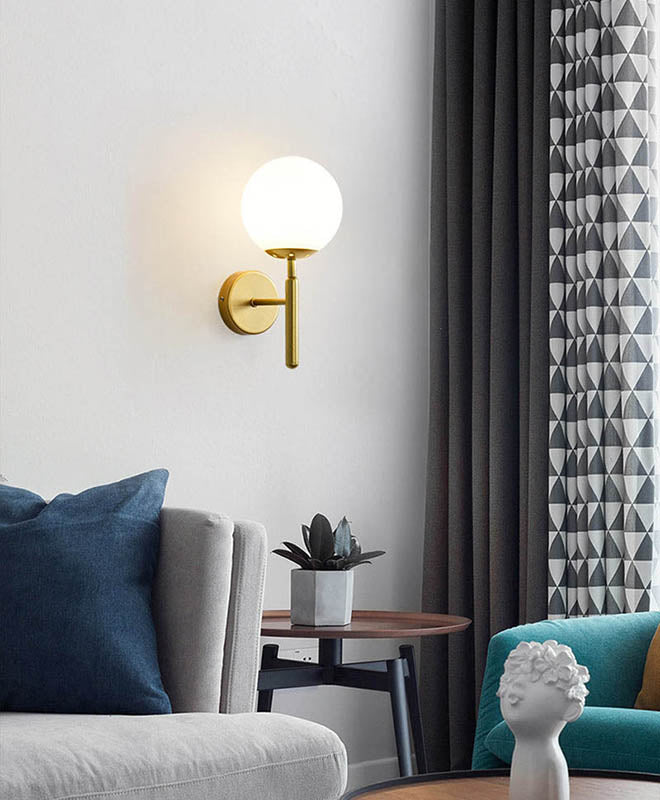 MAELKEBOLD modern glass ball wall light, gold Nordic LED sconce in a living room