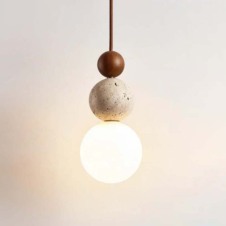 Pendant light with concrete and wood design on a neutral background