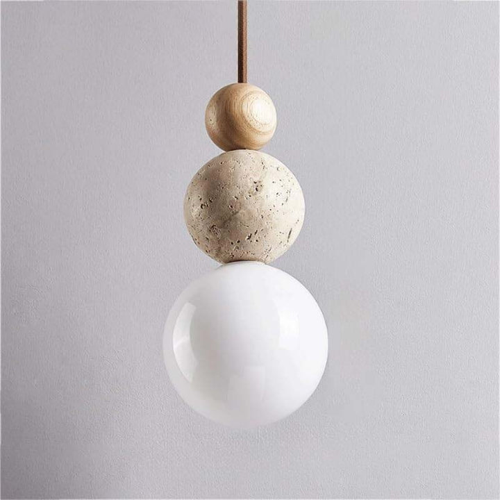 Pendant light with wooden and stone-like spherical elements on a plain background