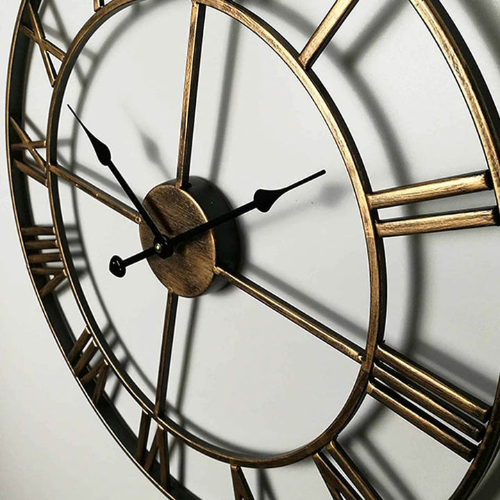 Gold / Brass open-frame Roman numeral wall clock in matte metal, 40cm, close-up showing slim profile and modern design.