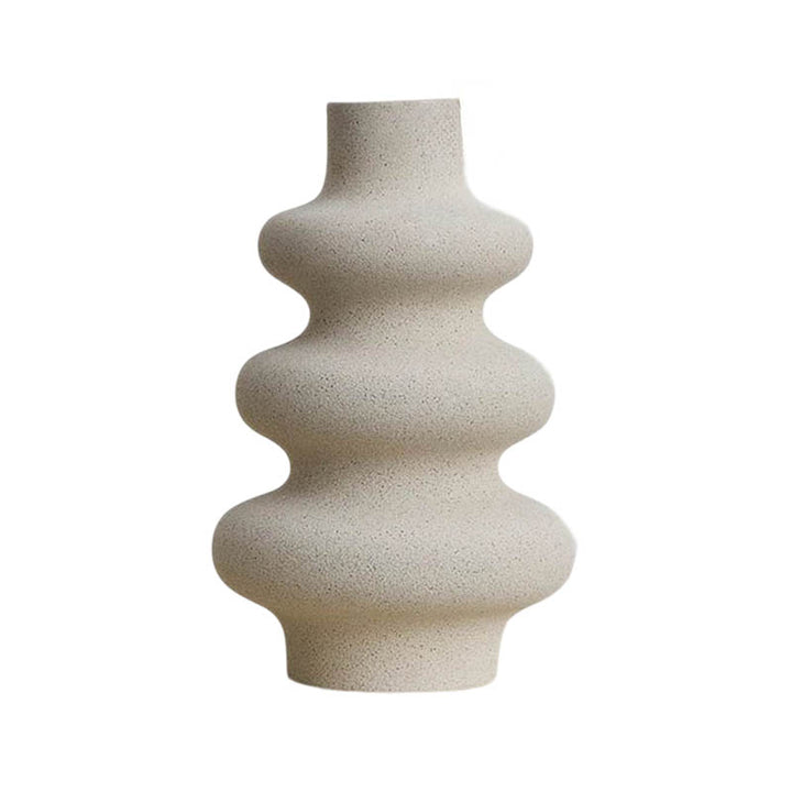 Tall modern ceramic vase with waved contour, natural sand tone, ideal for Scandinavian UK shelf styling