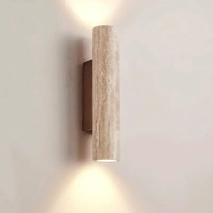 Wall-mounted cylindrical ordic Wall Lamp  on a plain wall