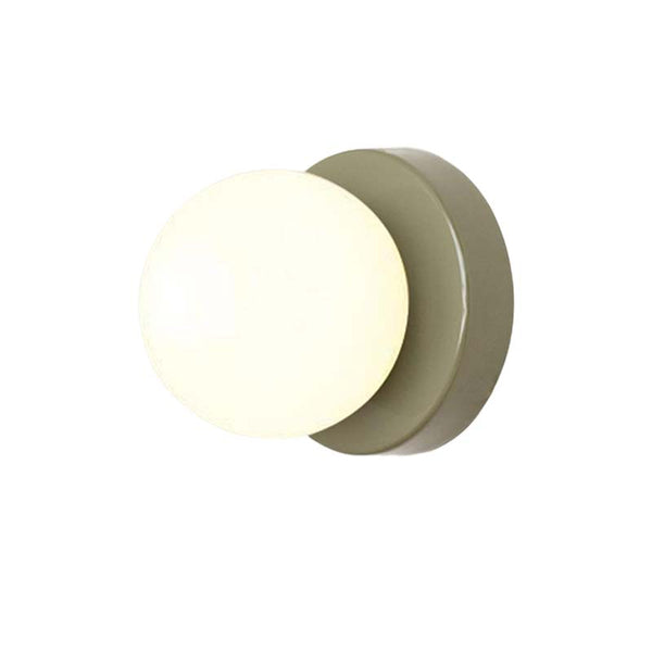 Round wall light fixture on a white background
