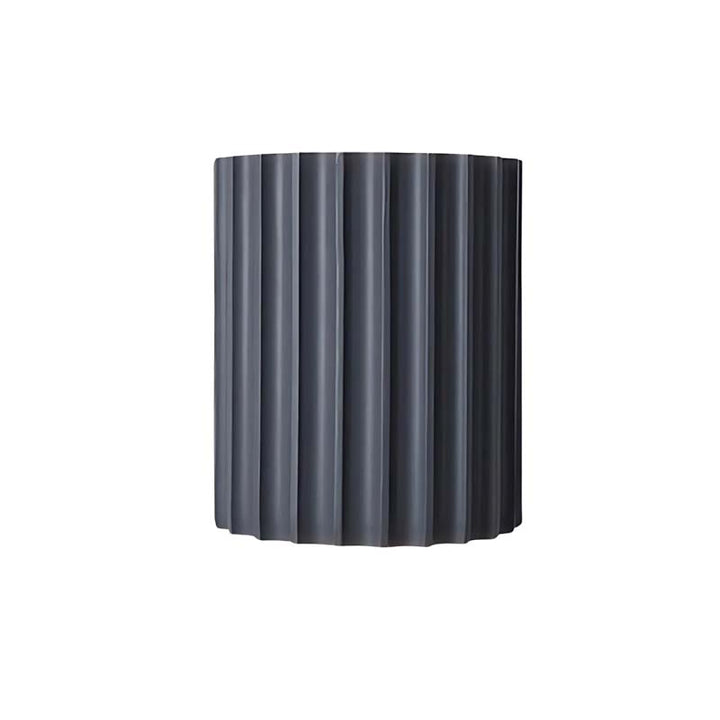 Dark grey ribbed cylindrical lampshade on a white background
