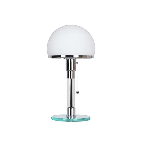 Table lamp with white glass shade and metal base on a white background