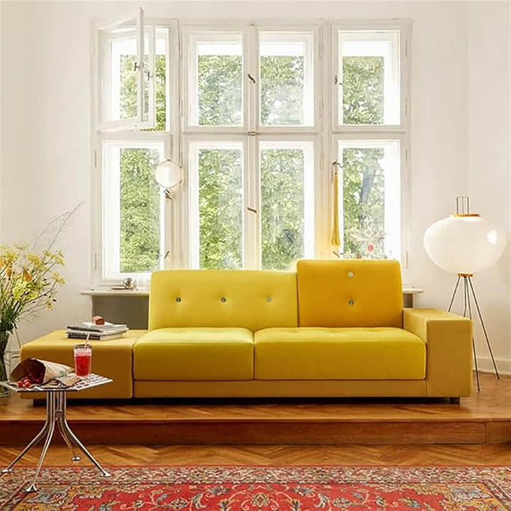 Japandi rice paper floor lamp beside yellow couch in bright Scandinavian-style UK living room.