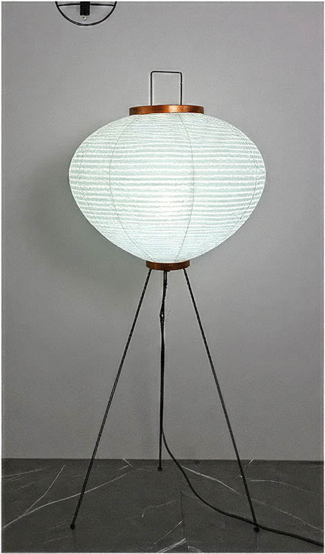 Contemporary Japanese-style floor lamp with washi paper shade, black tripod stand, ambient lighting for living spaces.