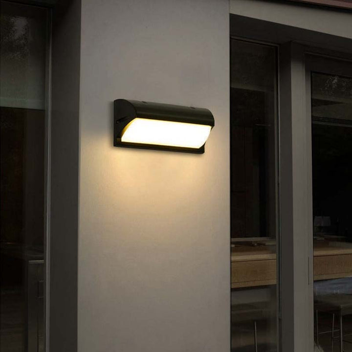 Wall-mounted outdoor light fixture on a building exterior.