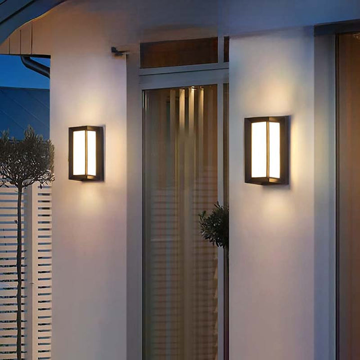 Two wall-mounted outdoor lights on a building exterior.