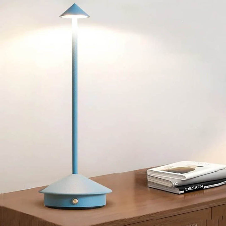 A sleek gray portable LED table lamp with a triangular shade and a circular base, powered by a USB cable.