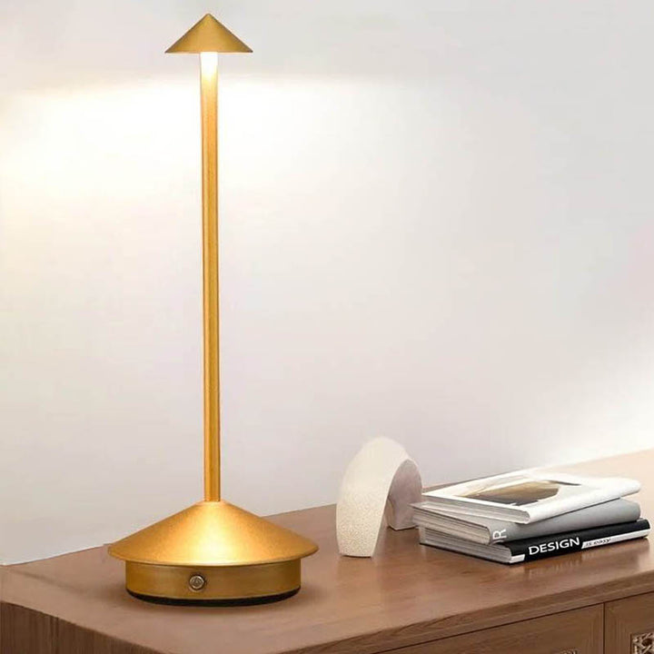A sleek gray portable LED table lamp with a triangular shade and a circular base, powered by a USB cable.