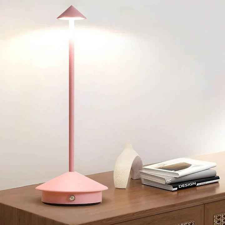 A sleek gray portable LED table lamp with a triangular shade and a circular base, powered by a USB cable.