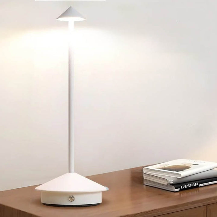 A sleek gray portable LED table lamp with a triangular shade and a circular base, powered by a USB cable.