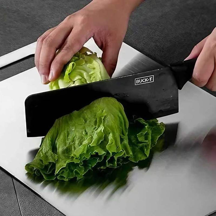 Cutting fresh lettuce on stainless steel cutting board – durable, antibacterial, hygienic kitchen surface