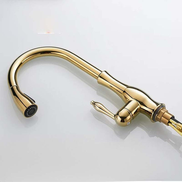 Gold kitchen faucet on a white background