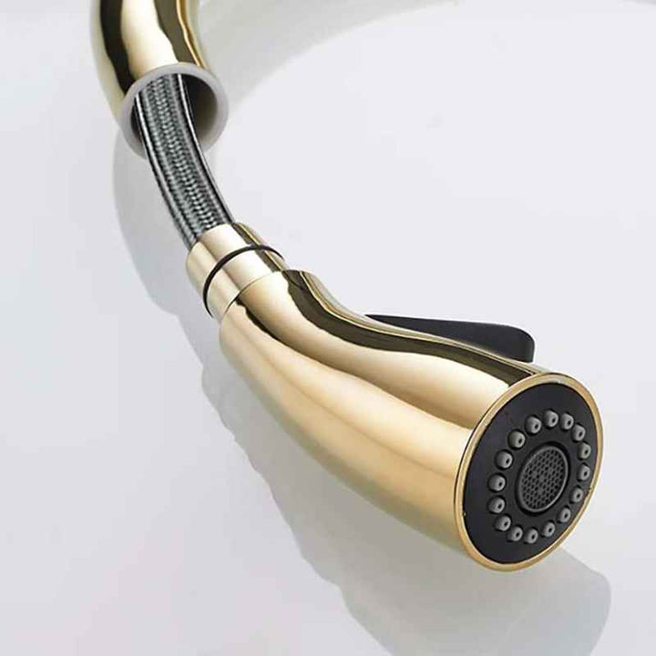 Gold kitchen faucet on a white background