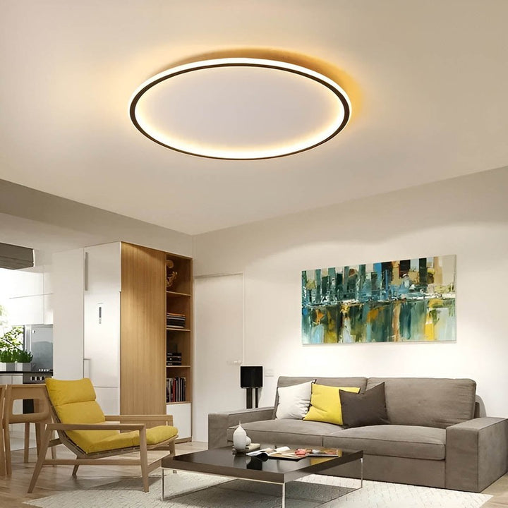Nordic Essentials RUND LED ceiling light in black, 80cm, illuminating a modern bedroom with adjustable brightness.