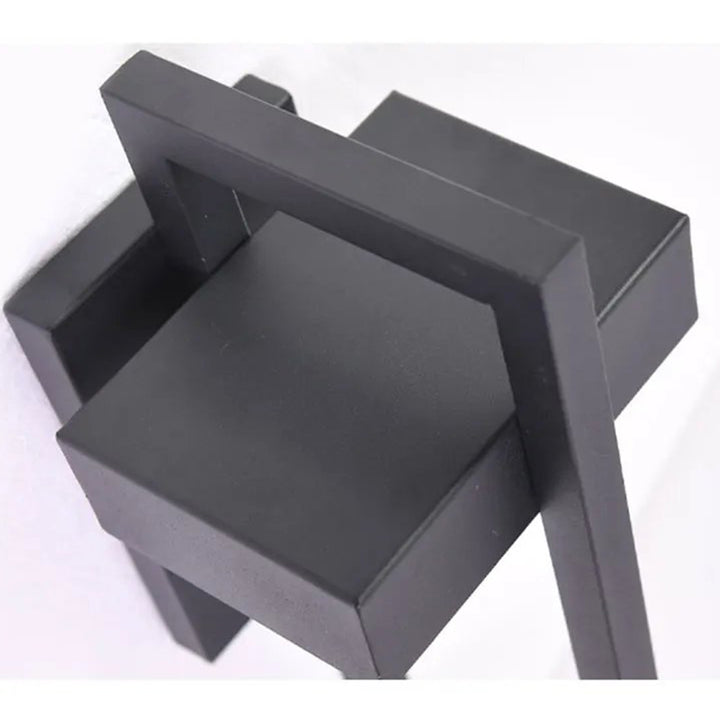Top angle of modern black outdoor LED wall sconce with sleek geometric design for contemporary exterior lighting