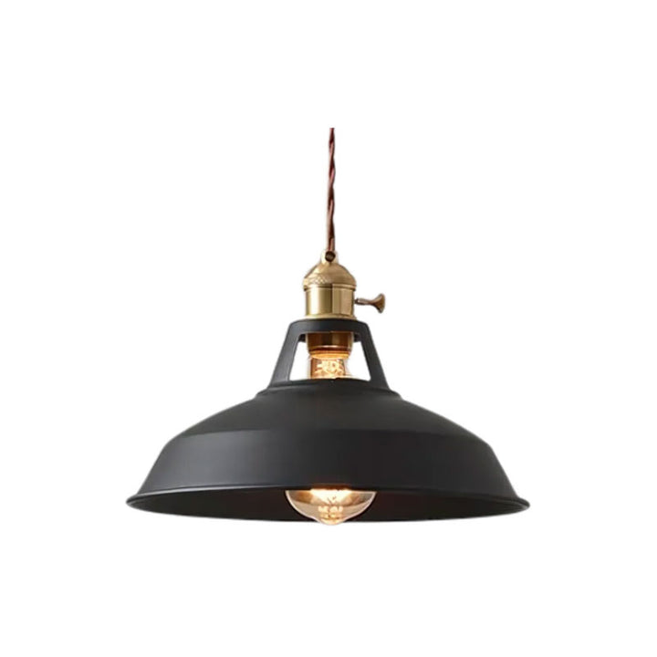 Black pendant light with gold fixture on a white background
