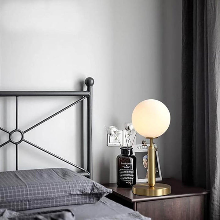 Minimalist oval brass lamp with frosted glass globe, Nordic-inspired design for uk bedroom