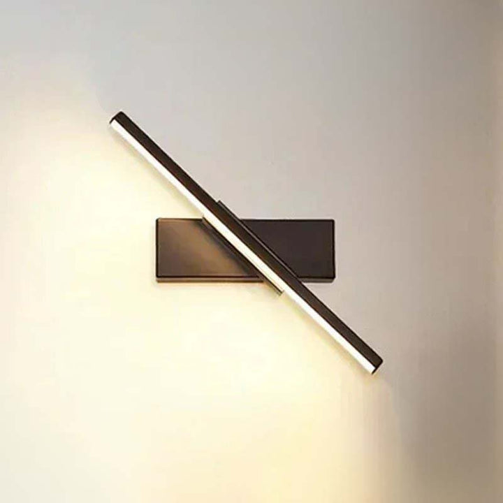 Modern wall-mounted light fixture on a plain wall