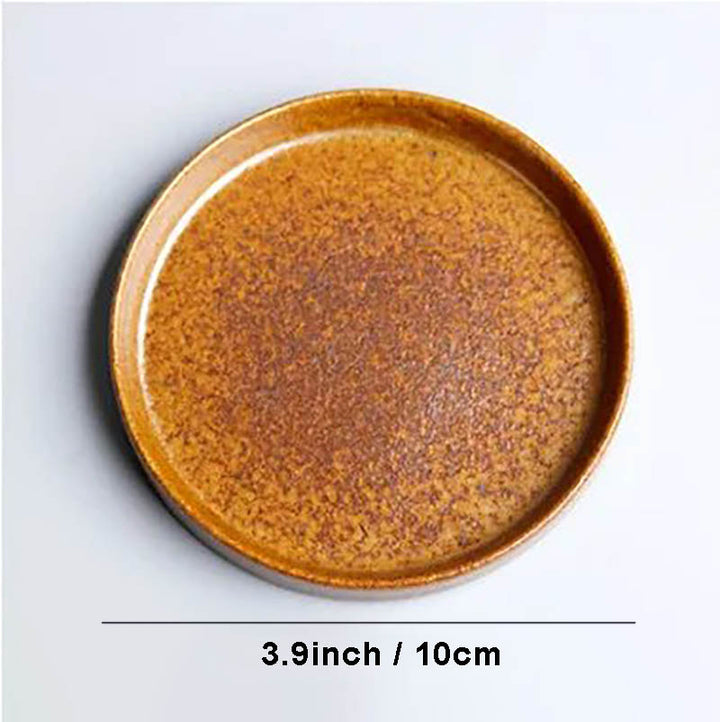 Small rustic ceramic tea saucer, 10cm diameter, warm golden brown glaze, complements tea cup set with wooden handle