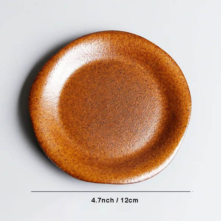 Handmade ceramic tea saucer, 12cm diameter, irregular rim, rustic orange-brown glaze, perfect for tea cup set