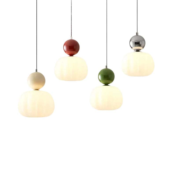 Pendant lights with colorful spherical beads on a white background