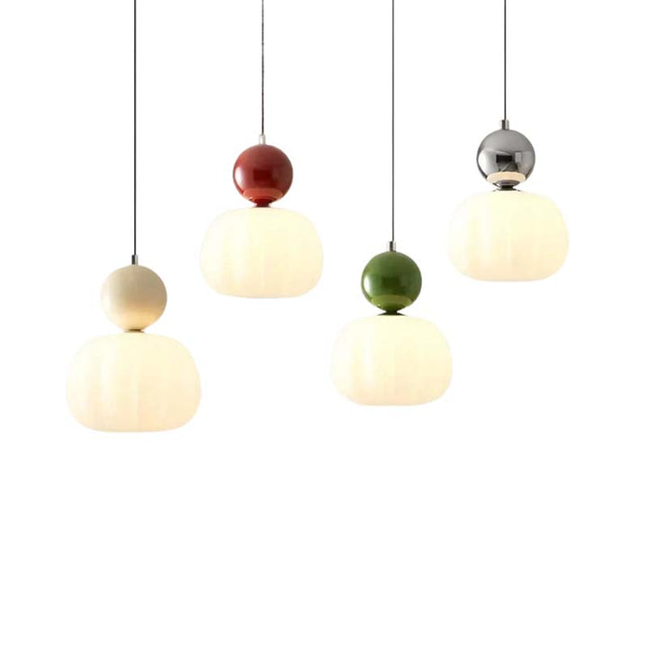Pendant lights with colorful spherical beads on a white background