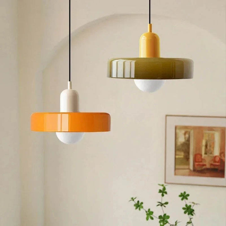 Bright Nordic pendant lights in orange and mustard, perfect above dining tables or reading corners.