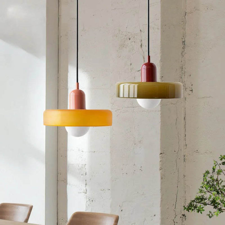 SLIK pendant lights in orange and yellow with ridged ceramic housing and LED bulb for kitchen use
