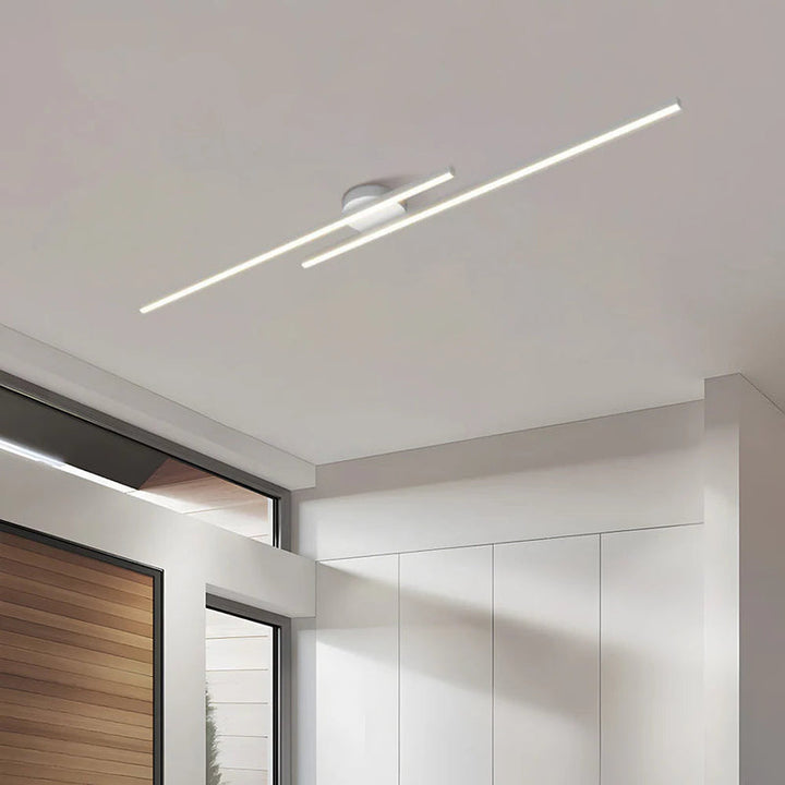 White aluminium LED strip ceiling light with minimalist design in modern room.