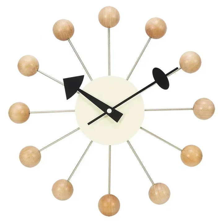 Minimalist wall clock with natural wood ball accents and black geometric hands on white frame