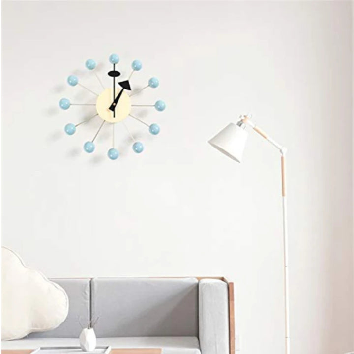 Minimalist Scandinavian wall clock with silver round frame and multicolour wooden ball markers