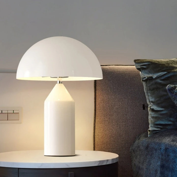 White SVAMPS metal mushroom lamp on bedside table, minimalist LED lighting for Nordic-style bedrooms.