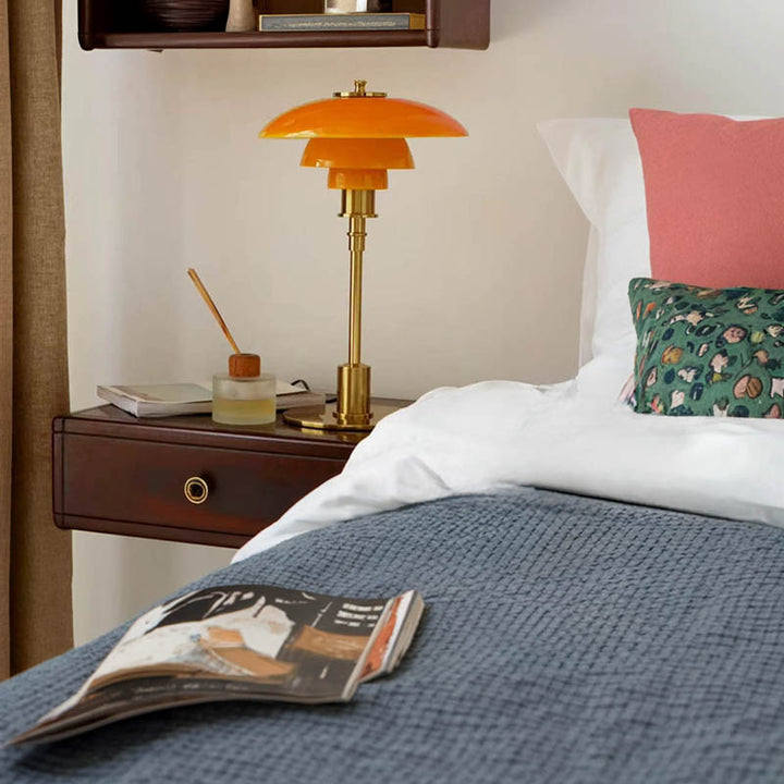 Orange Nightstand Light on a nightstand table beside the bed in a modern uk bedroom.