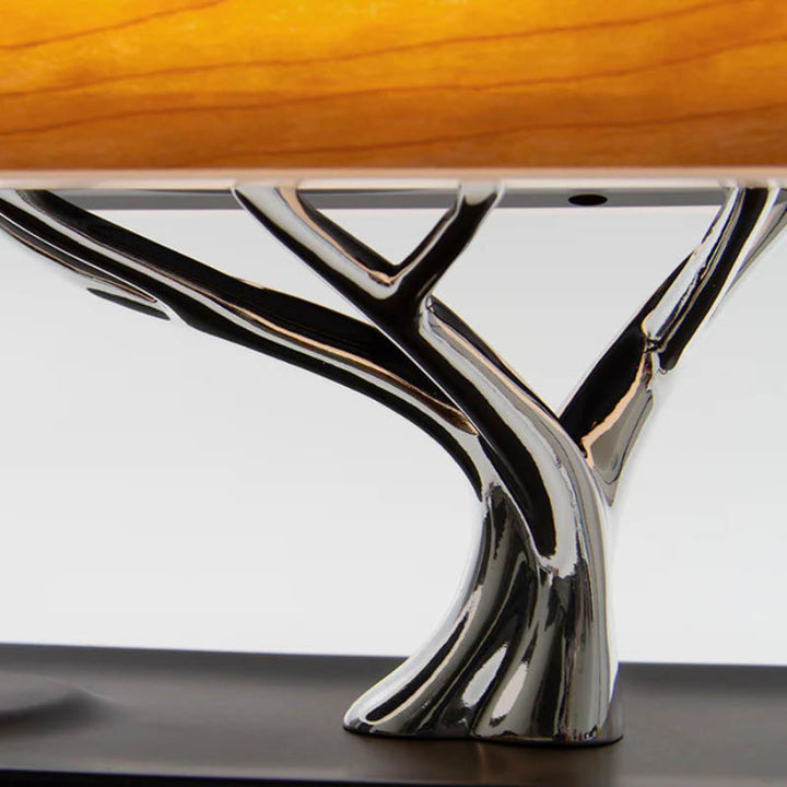 Chrome tree-inspired lamp base supporting wood LED shade, modern Nordic design