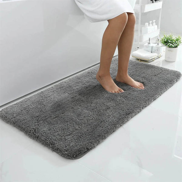 Dark grey absorbent bath mat with non-slip TPR backing, ideal for tiled UK bathroom floors