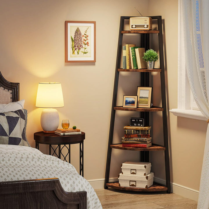Tall wooden ladder shelf in a bedroom with books, photos, and decor items.