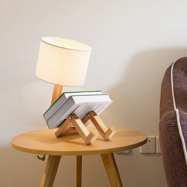 Wooden creative table lamp with a modern design, warm LED lighting, and a natural finish, perfect for decorative home or office ambiance.