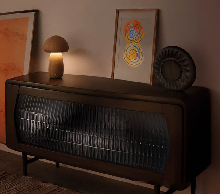 Mushroom lamp on a retro stereo cabinet, creating soft ambient lighting.
